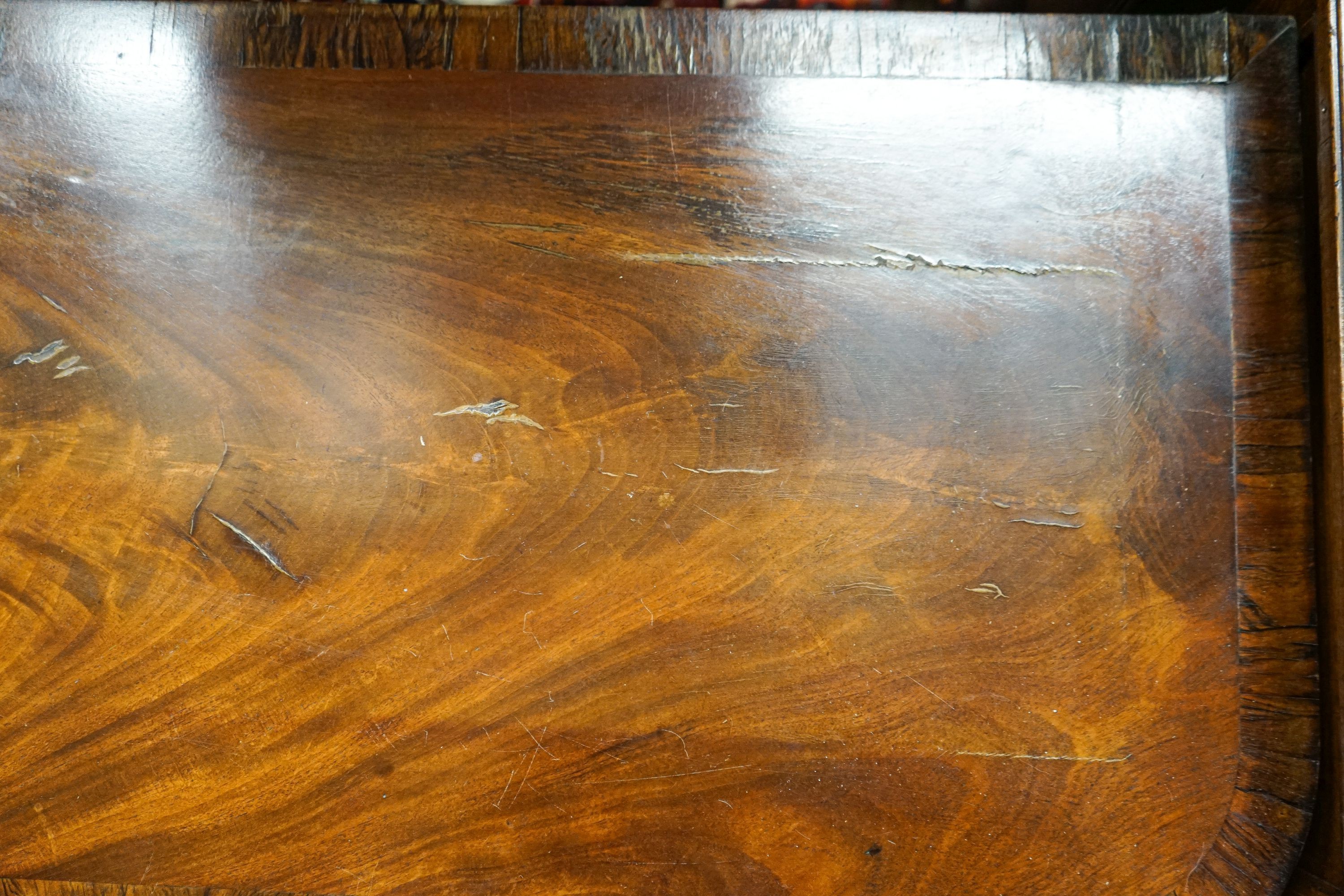 A late Regency mahogany banded folding card table, width 89cm, depth 44cm, height 70cm